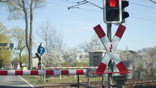 level crossing with lowered barrier and traffic li 2025 01 10 15 06 34 utc
